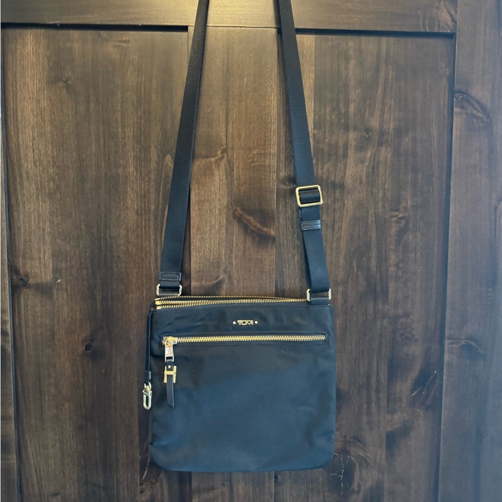 Tumi Black Crossbody Bag with Gold Details